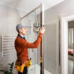 professional handyman working in shower booth indo 2023 04 22 03 45 51 utc scaled - Shower Doors of Charlotte
